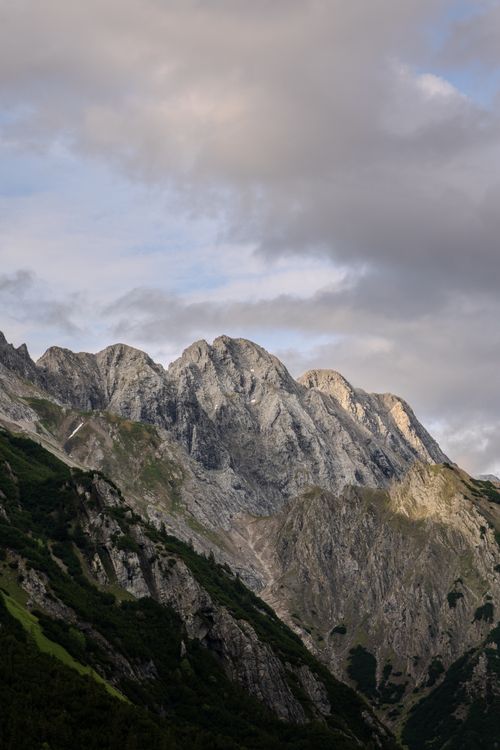 Free Breathtaking view of the Austrian Alps showcasing rocky peaks under a cloudy sky. Stock Photo