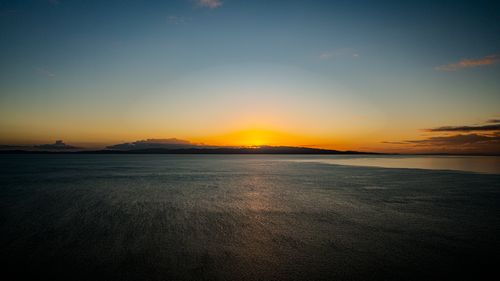 Free Stunning sunset over calm New Zealand waters, capturing serene sky and sea. Stock Photo