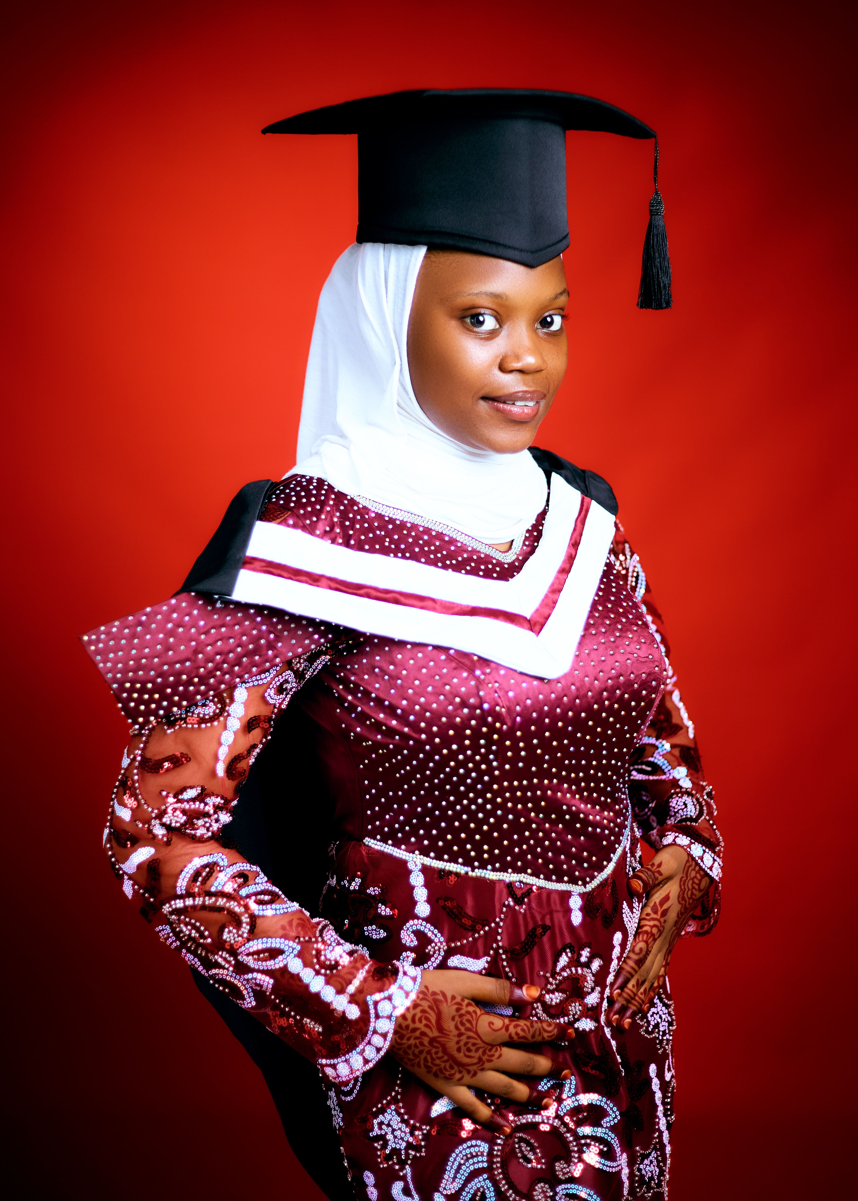 Young Graduate in Traditional Attire with Cap · Free Stock Photo