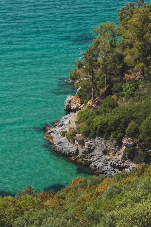 Free Stunning coastal view with rocky shores and clear turquoise waters. Stock Photo