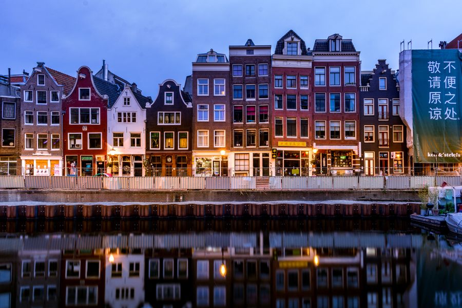 European canal houses at twilight representing Europe work permit pathways