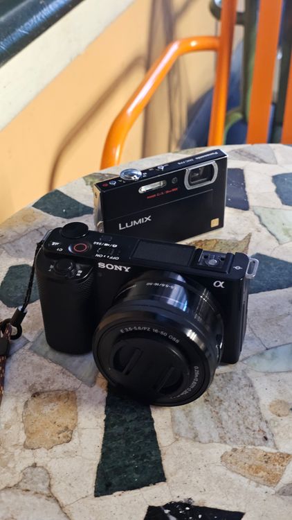 Close-up of Two Digital Cameras on Mosaic Table · Free Stock Photo