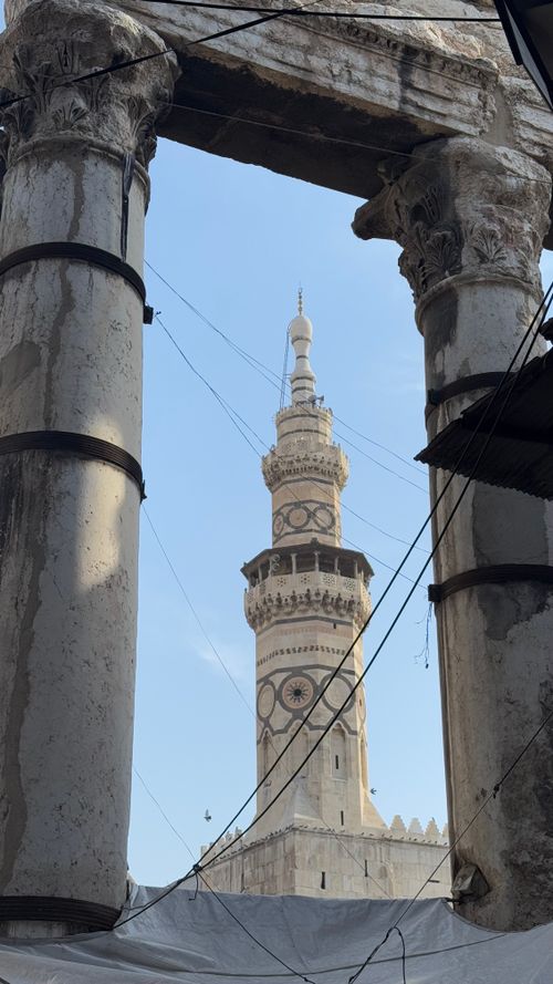 Free Historic minaret framed by ancient ruins in Damascus, showcasing architectural heritage. Stock Photo