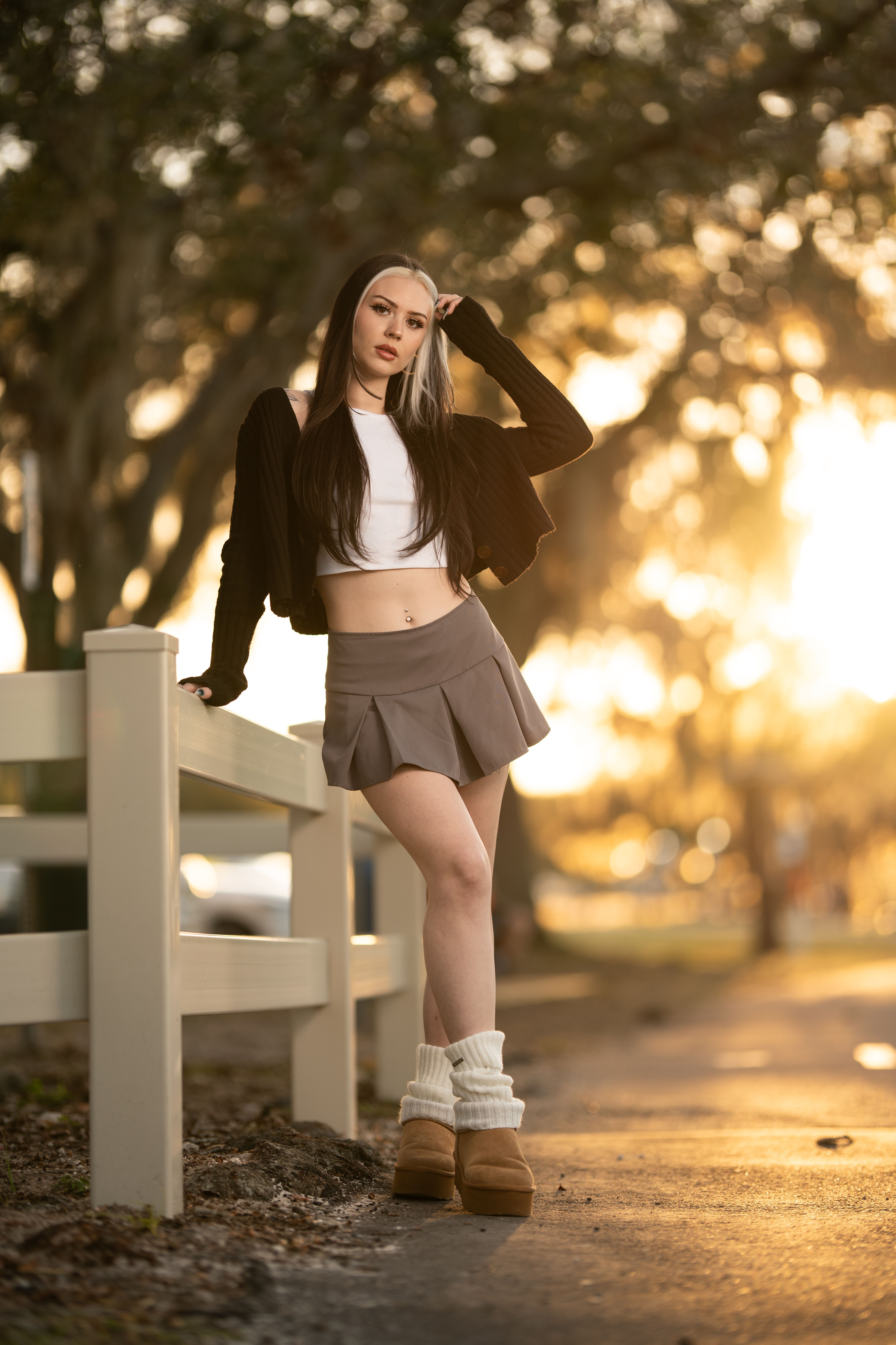 Young Woman Posing Outdoors at Sunset · Free Stock Photo