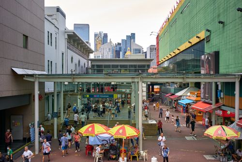 Free Urban scene in Chinatown, Singapore, with bustling streets and modern architecture in the background. Stock Photo