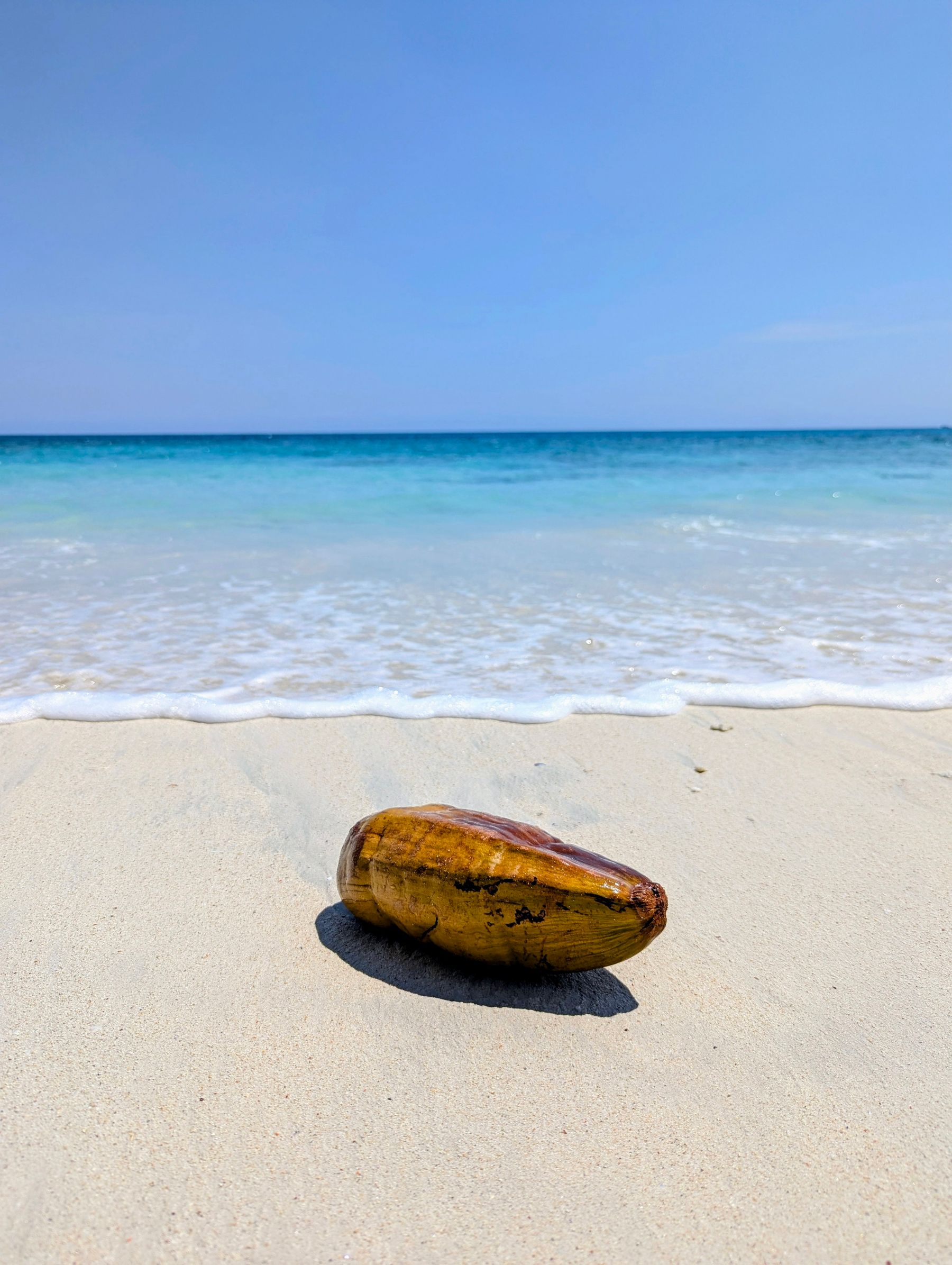 Shallow turquoise water over pale sand on an Andaman beach