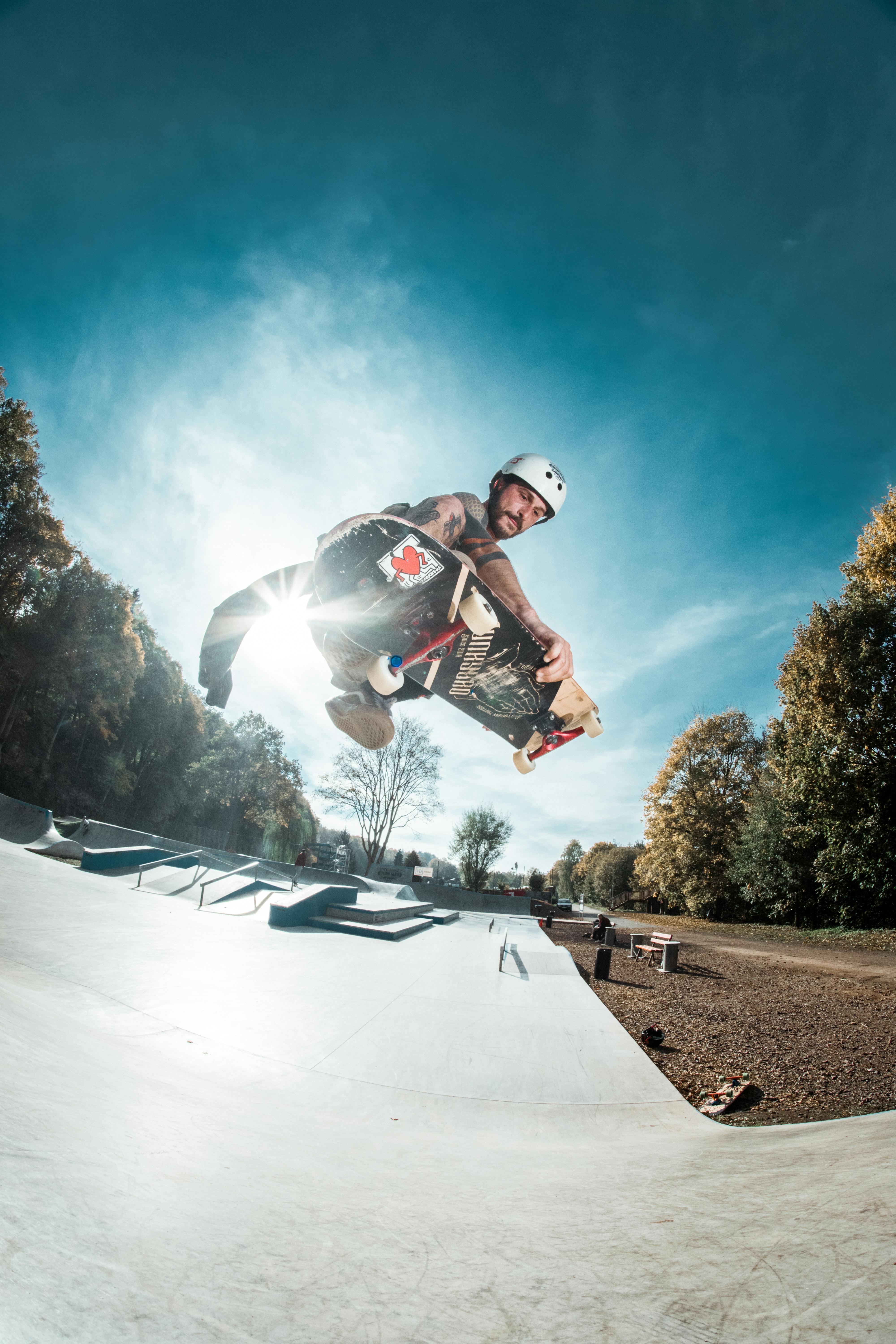 Skateboarder performing a high-flying trick in Trutnov skatepark, captured in an energetic leap.