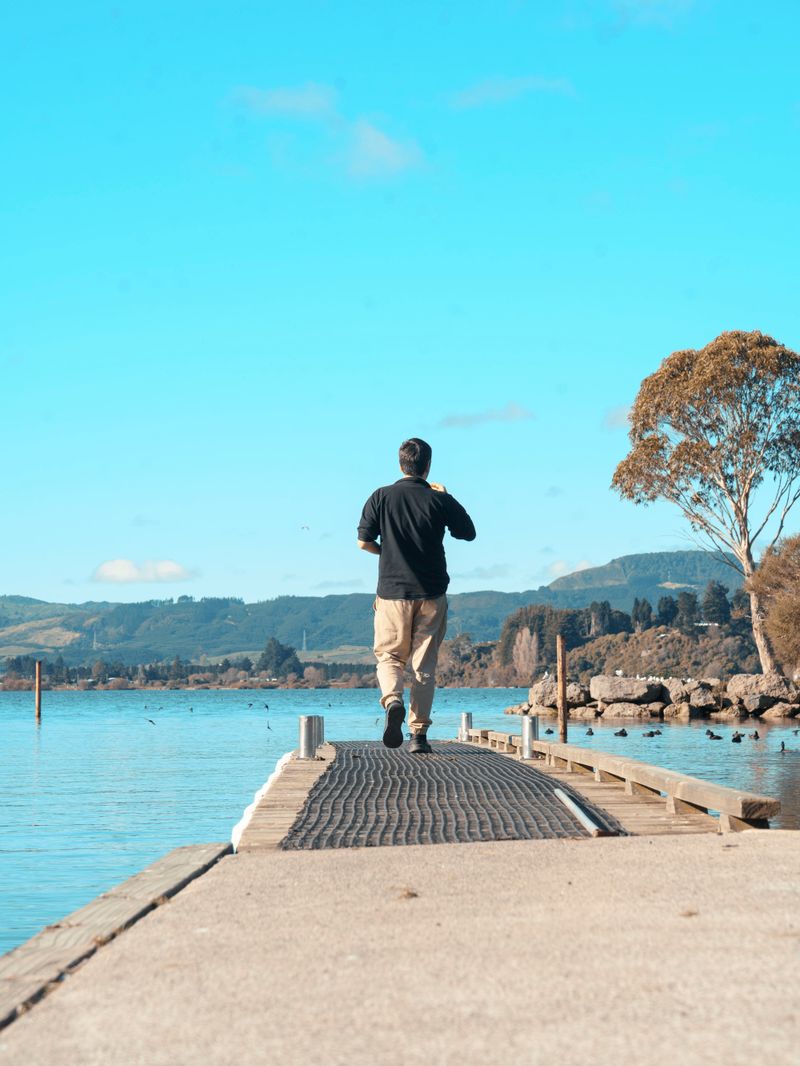 Man walking on the pier at the Rotorua Lakefront