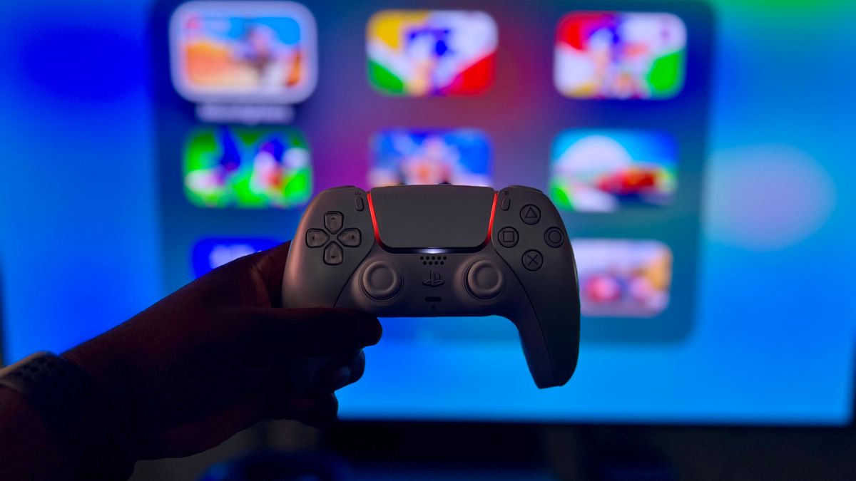 Close-up of a gaming controller against a vibrant screen in London, England.