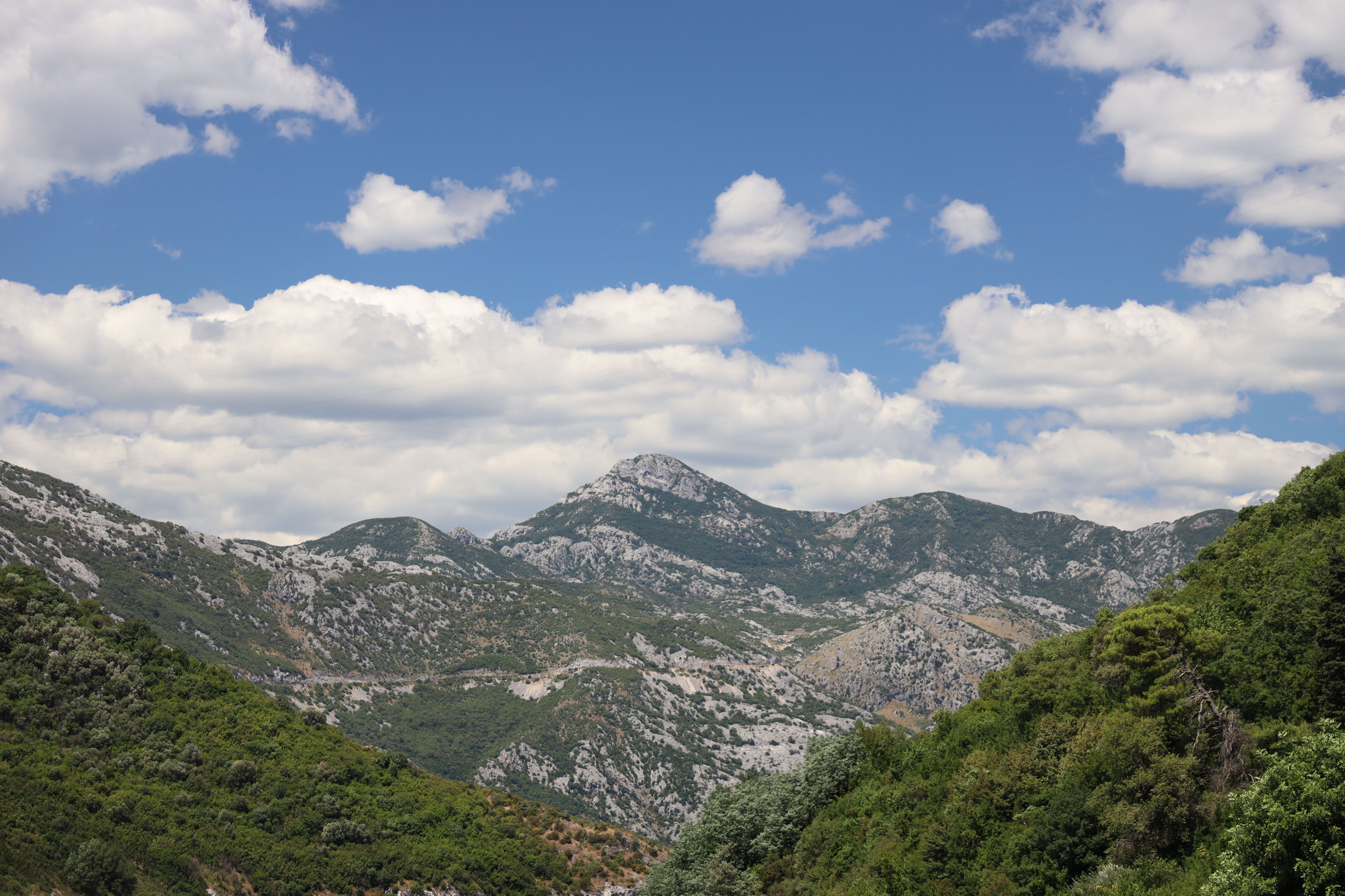 Breathtaking Mountain Landscape Under Cloudy Sky · Free Stock Photo