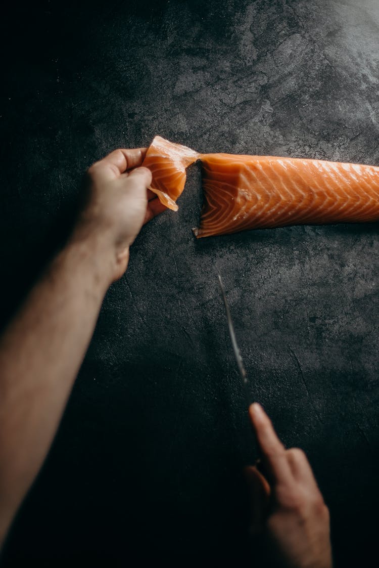 Photo Of Person Slicing Sashimi