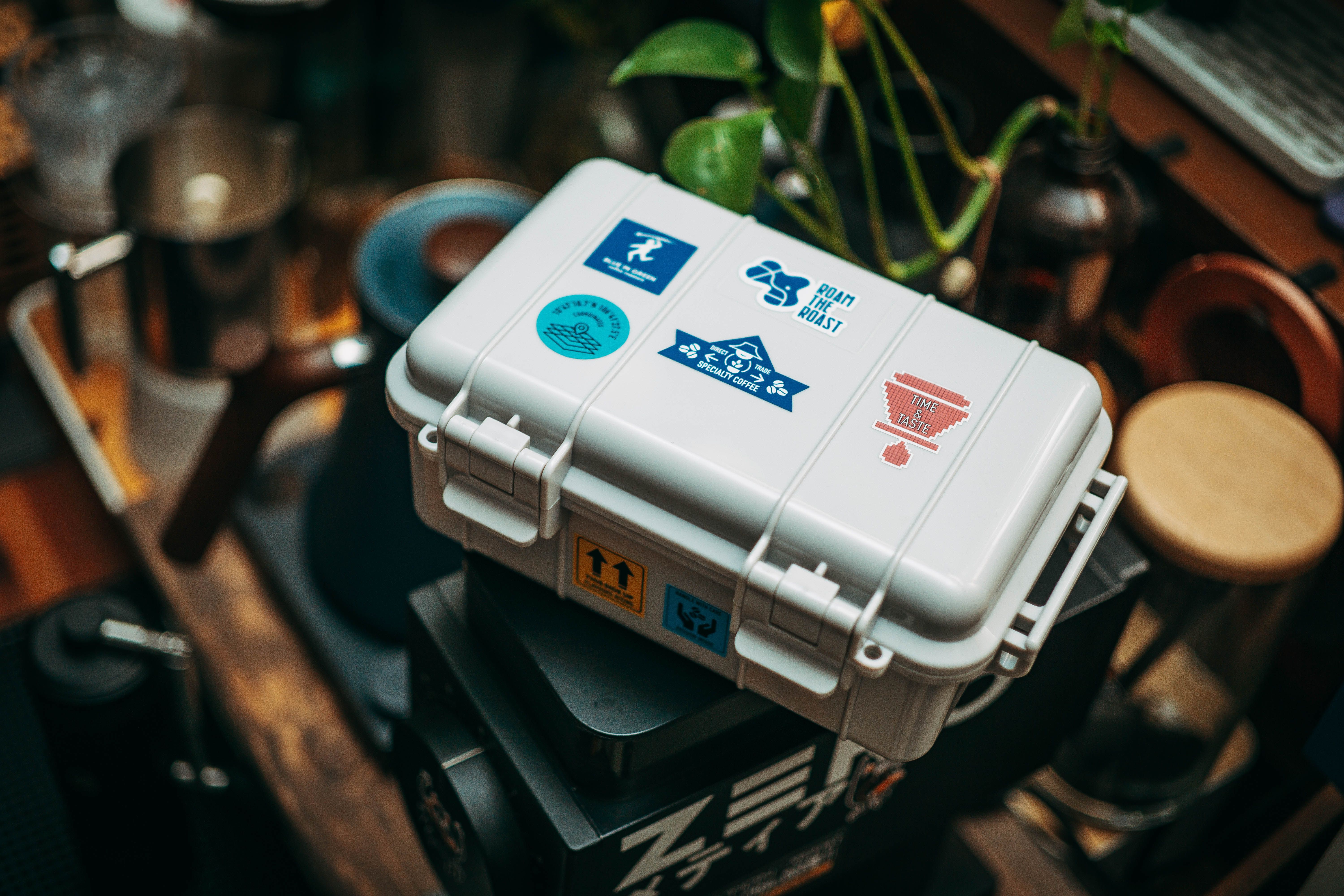 Stylish Coffee Gear Case with Various Stickers · Free Stock Photo