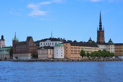 Free Explore the stunning historic architecture along Stockholm's waterfront captured on a sunny day. Stock Photo