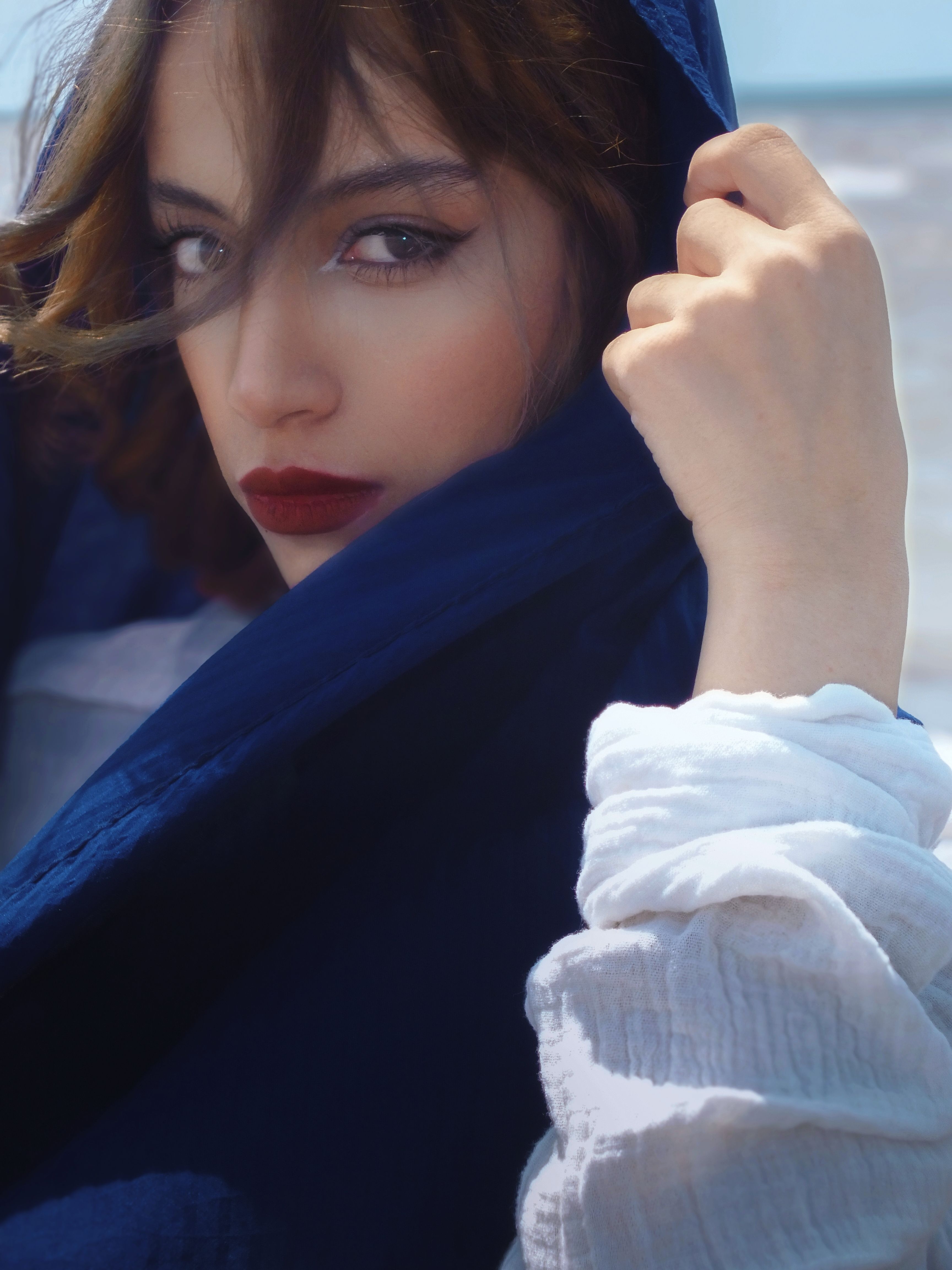 Portrait of a Woman With a Blue Scarf Outdoors · Free Stock Photo