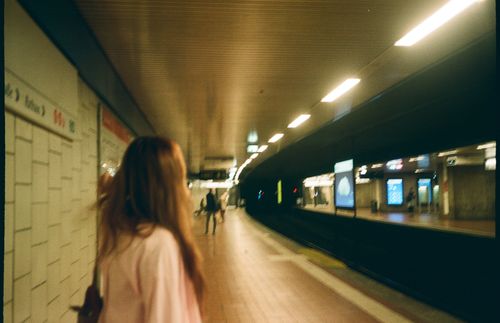 Free Dynamic image capturing motion in a Stuttgart train station tunnel, featuring commuters. Stock Photo