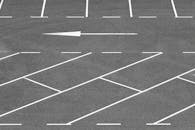 Empty Parking Lot with Arrow and Lines