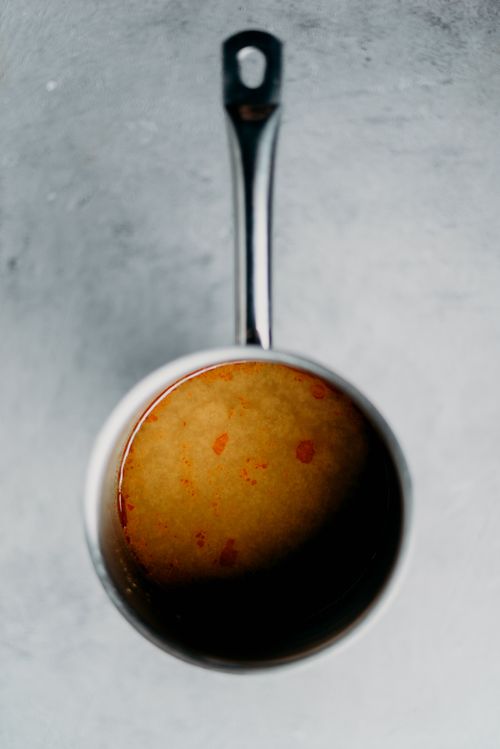 Free High-angle shot of a pot filled with flavorful soup, showcasing rich textures. Stock Photo