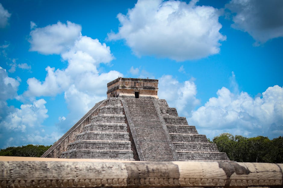 best time of year to visit mayan ruins - Explore the ancient beauty of the Pyramid of Chichén Itzá against a vibrant blue sky in Yucatán, Mexico.