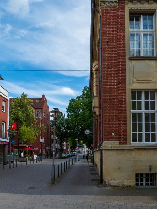 Free A picturesque urban street scene featuring classic red brick architecture on a sunny day. Stock Photo