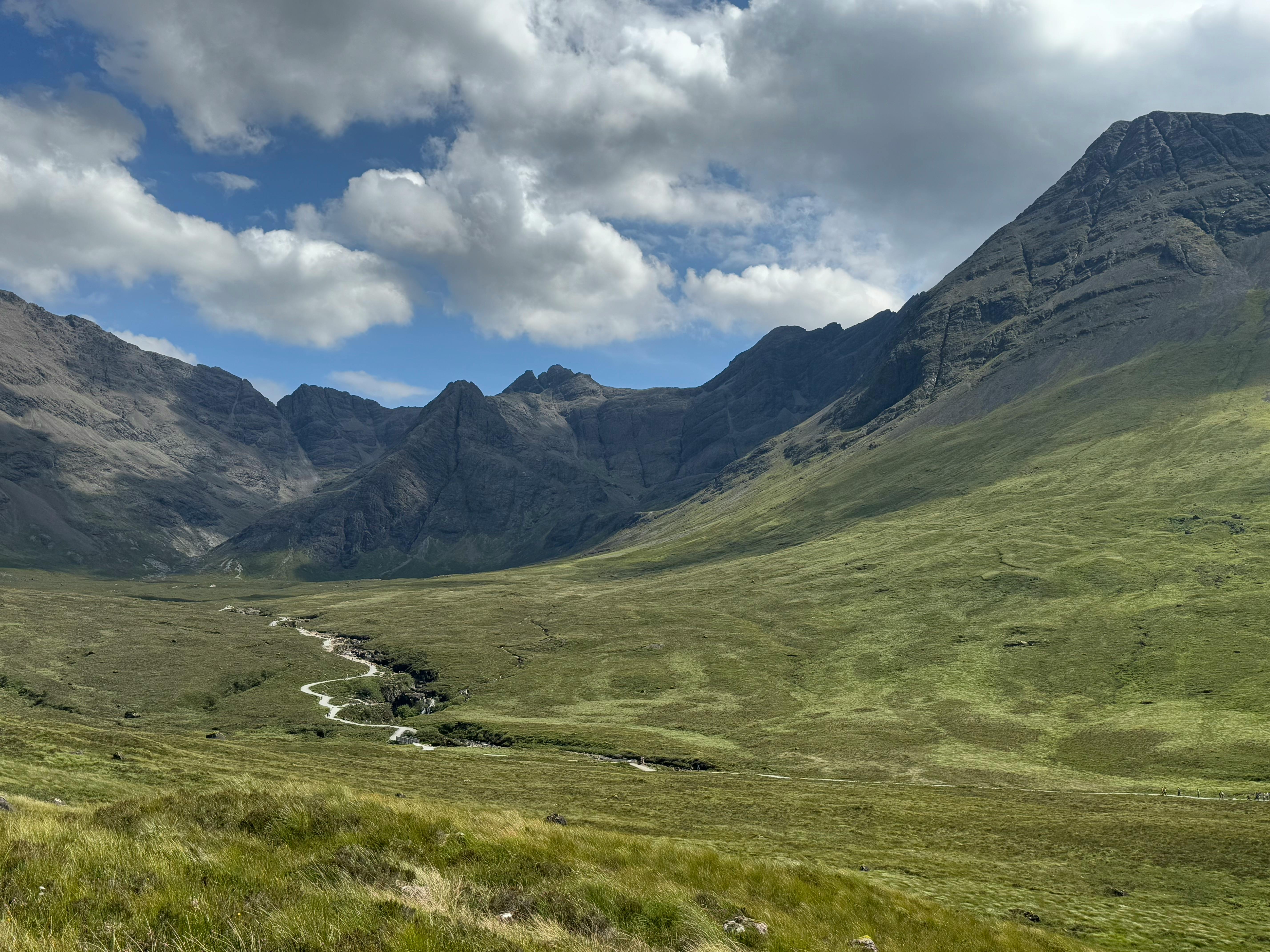 Breathtaking landscape of Cuillin Mountains under dramatic clouds, Scotland.