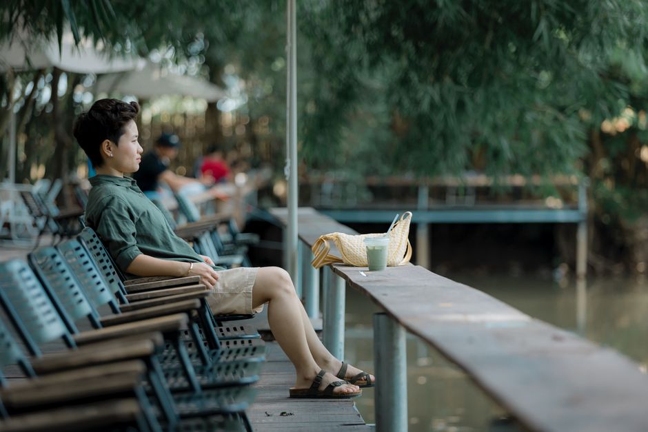 Travelers hydrating with water bottles in hot Cambodian weather