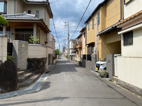 Calm residential alley in a Japanese neighborhood with traditional homes.