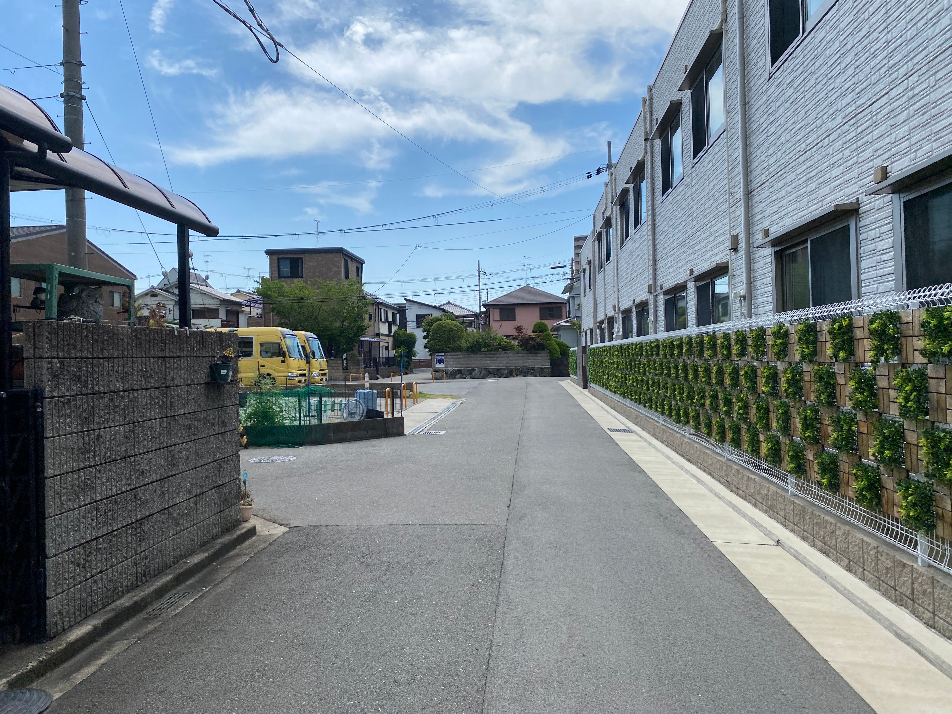 Japanese residential neighbourhood street with delivery truck and houses