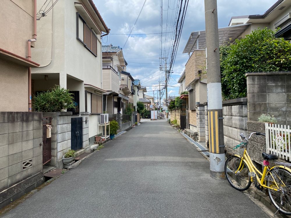 Typical Japanese residential street with houses and bicycles