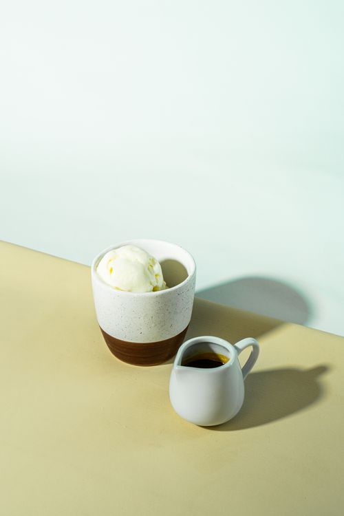 Free A beautifully styled affogato with vanilla ice cream and espresso in soft light. Stock Photo