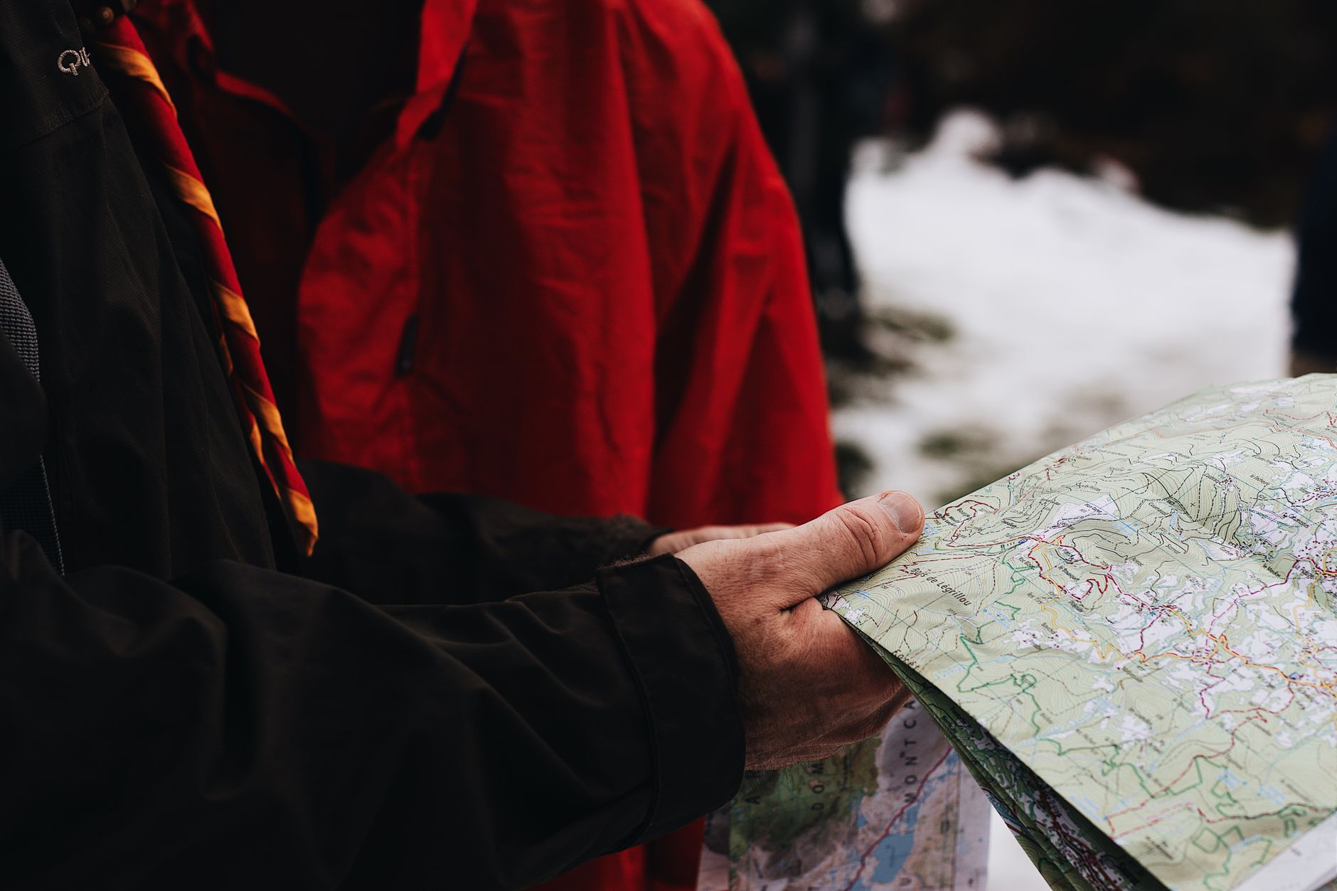 hiker reading map wilderness trail
