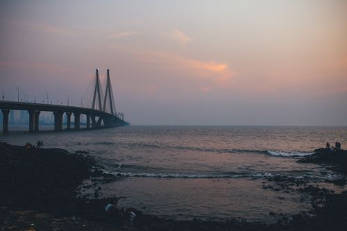 Free Stunning view of the Bandra-Worli Sea Link at sunset, capturing the bridge and Arabian Sea. Stock Photo