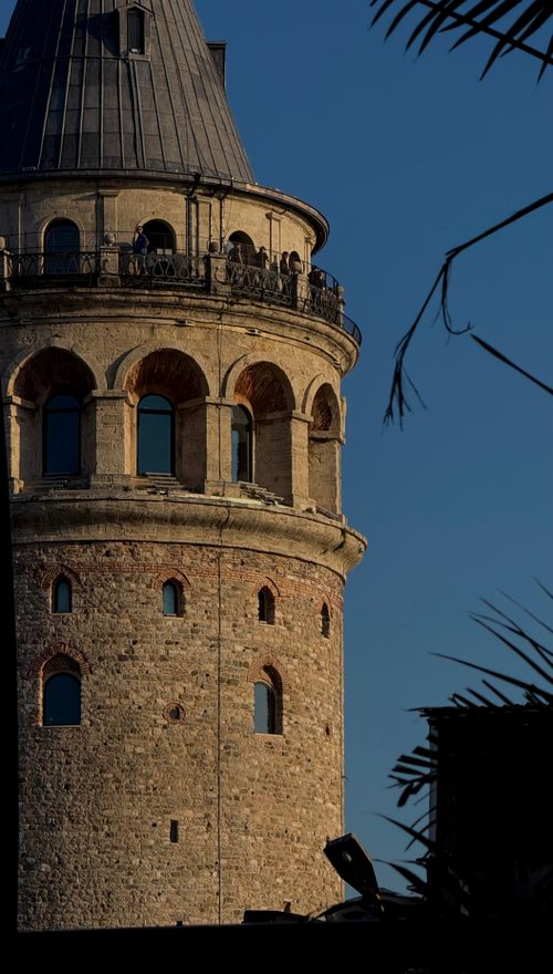 Free Close-up view of the historic Galata Tower in Istanbul under a clear blue sky, showcasing its architectural details. Stock Photo