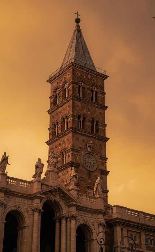 Free Stunning view of a historic church tower in Lazio, Italy at sunset, capturing its architectural beauty. Stock Photo