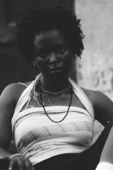 Moody black and white portrait of an alternative beauty embracing individuality.