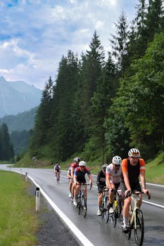 Cyclists compete in a race on a scenic Alpine road in Tirol, Austria.