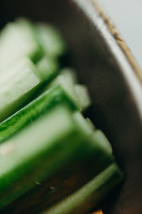 Free Close-up of fresh cucumber slices in a bowl, perfect for healthy food themes. Stock Photo