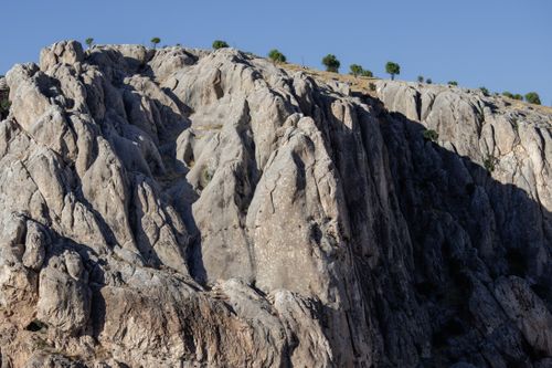 Free Majestic rocky cliff under clear blue sky in Elazığ, Türkiye, showcasing natural beauty. Stock Photo