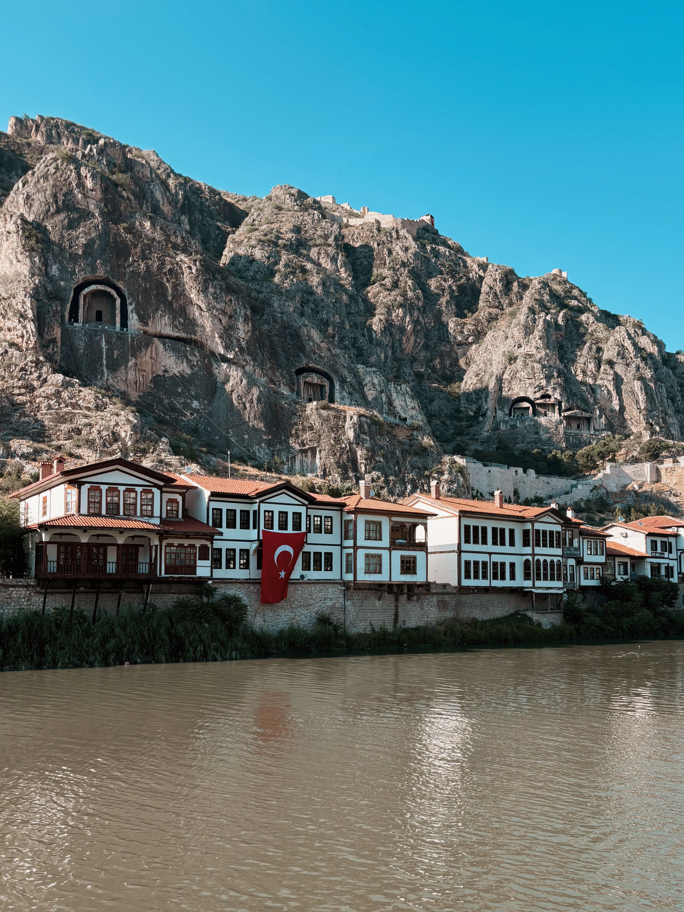 Scenic Amasya view with Ottoman houses and mountains by the river.