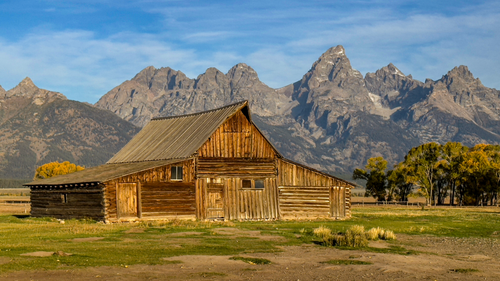 Free Historic T.A. Moulton Barn set against the stunning Grand Tetons in Wyoming. Stock Photo