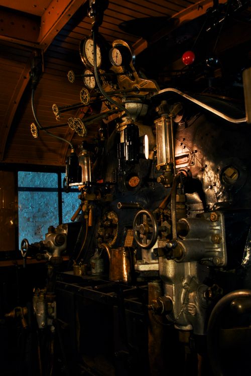 Free Close-up of a vintage steam train engine's interior, highlighting gauges and controls. Stock Photo