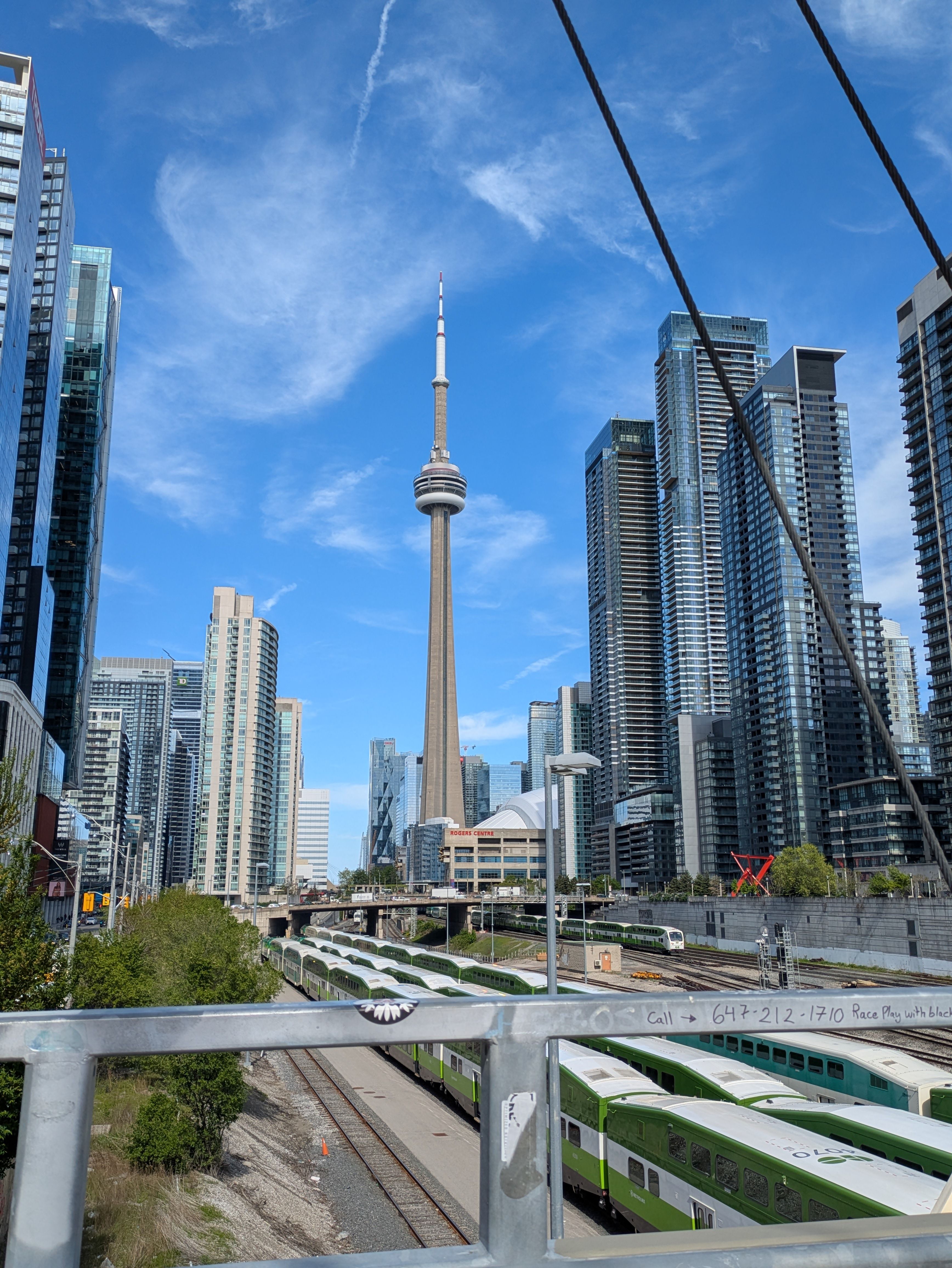 Toronto Skyline with CN Tower and Train Tracks · Free Stock Photo