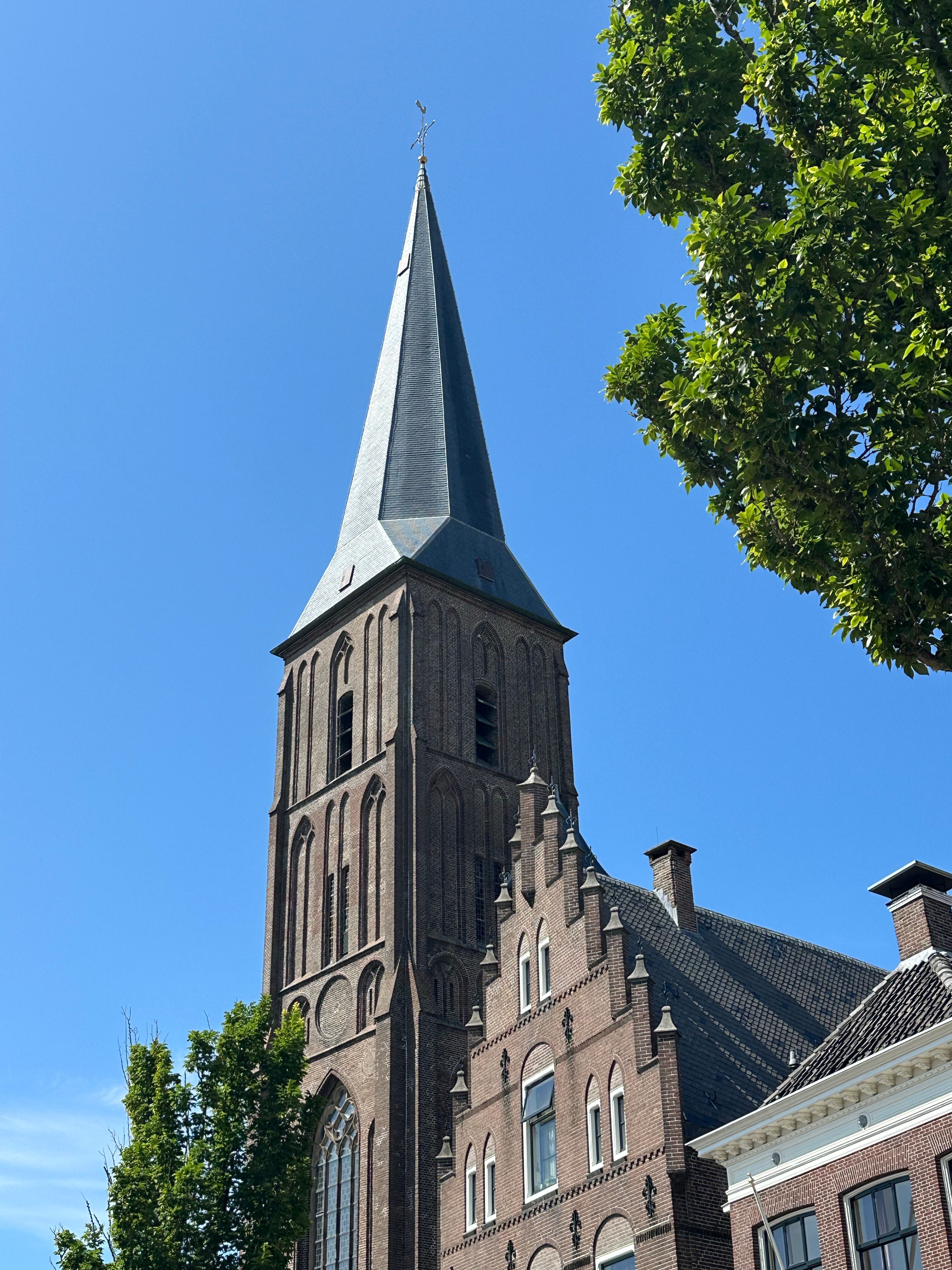 Historic Gothic Church Tower Against Bright Sky · Free Stock Photo