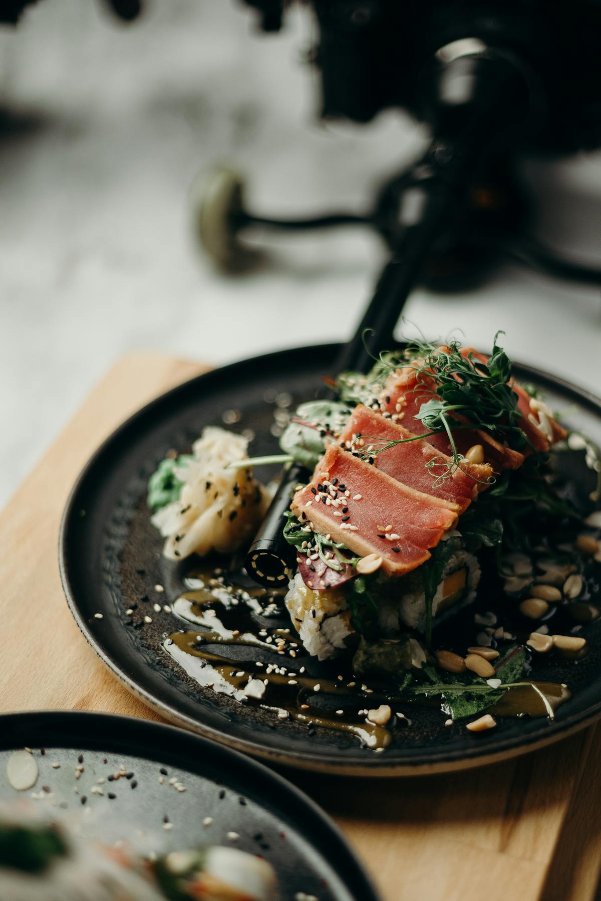 Lemon herb chicken served over quinoa with vegetables in a shallow bowl
