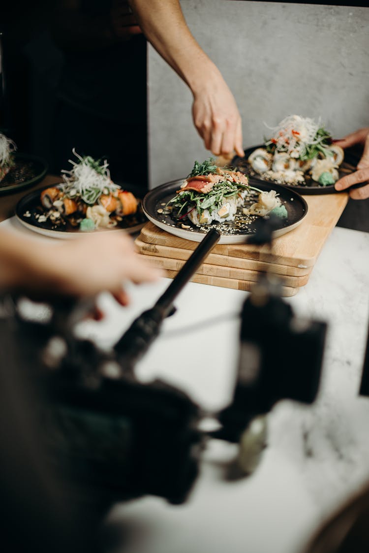 Japanese Food On Three Serving Plates