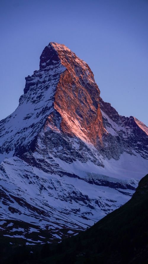 Free Breathtaking view of the Matterhorn, Zermatt, Switzerland, illuminated by the sunset glow. Stock Photo