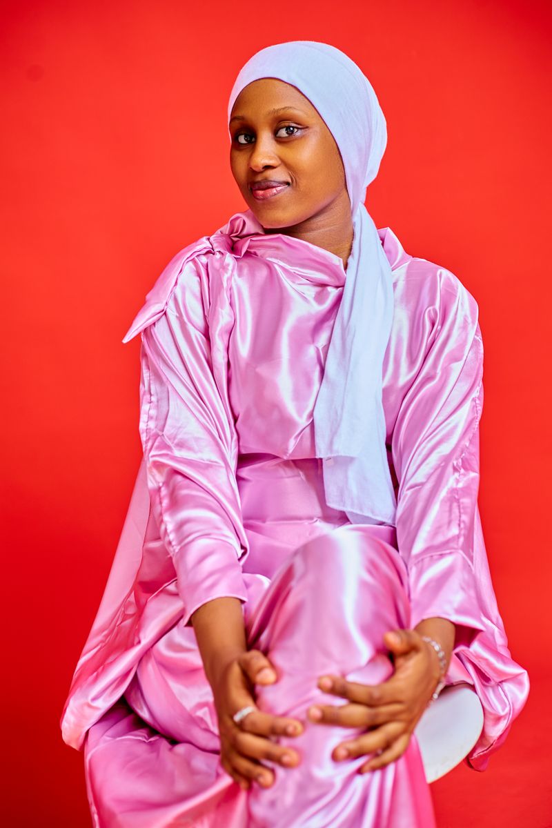 Elegant portrait of woman in pink satin attire
