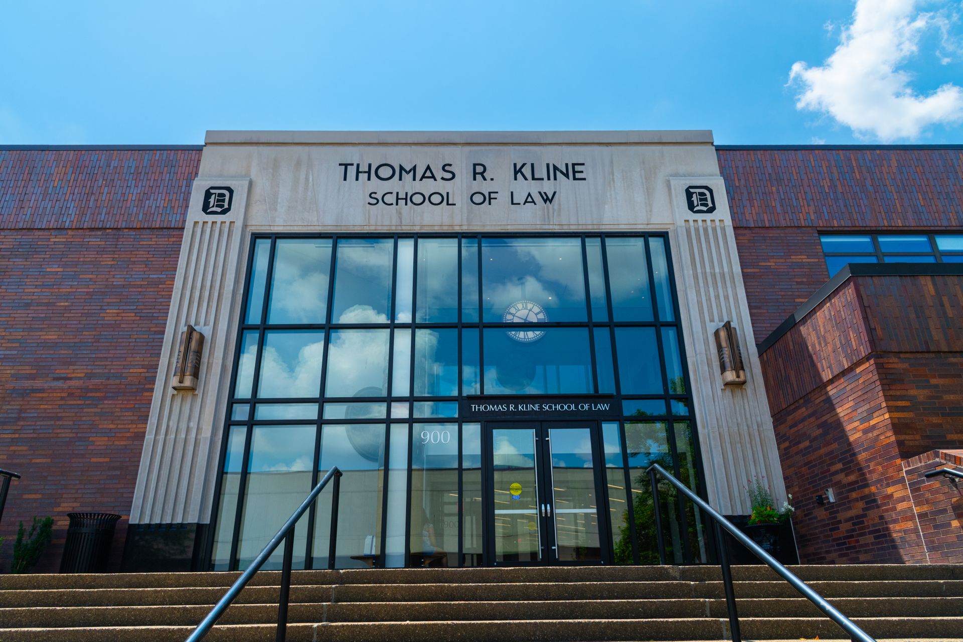 Front view of Thomas R. Kline School of Law building on a sunny day with clear sky.
