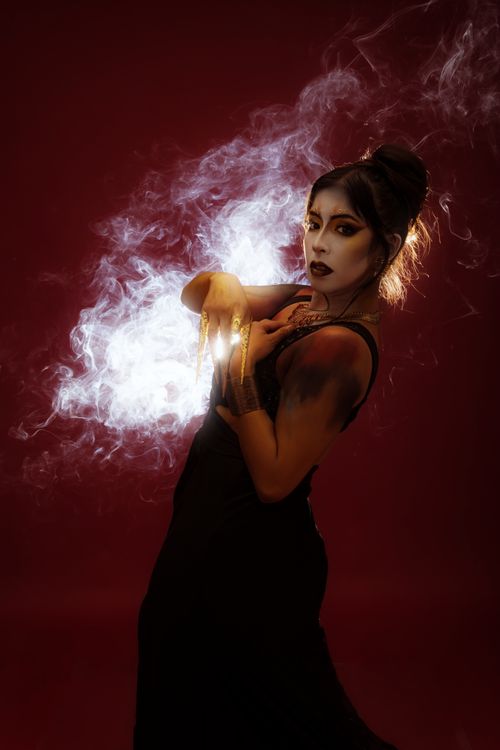 Free Enchanting portrait of a woman in mystical smoke and dramatic lighting. Stock Photo