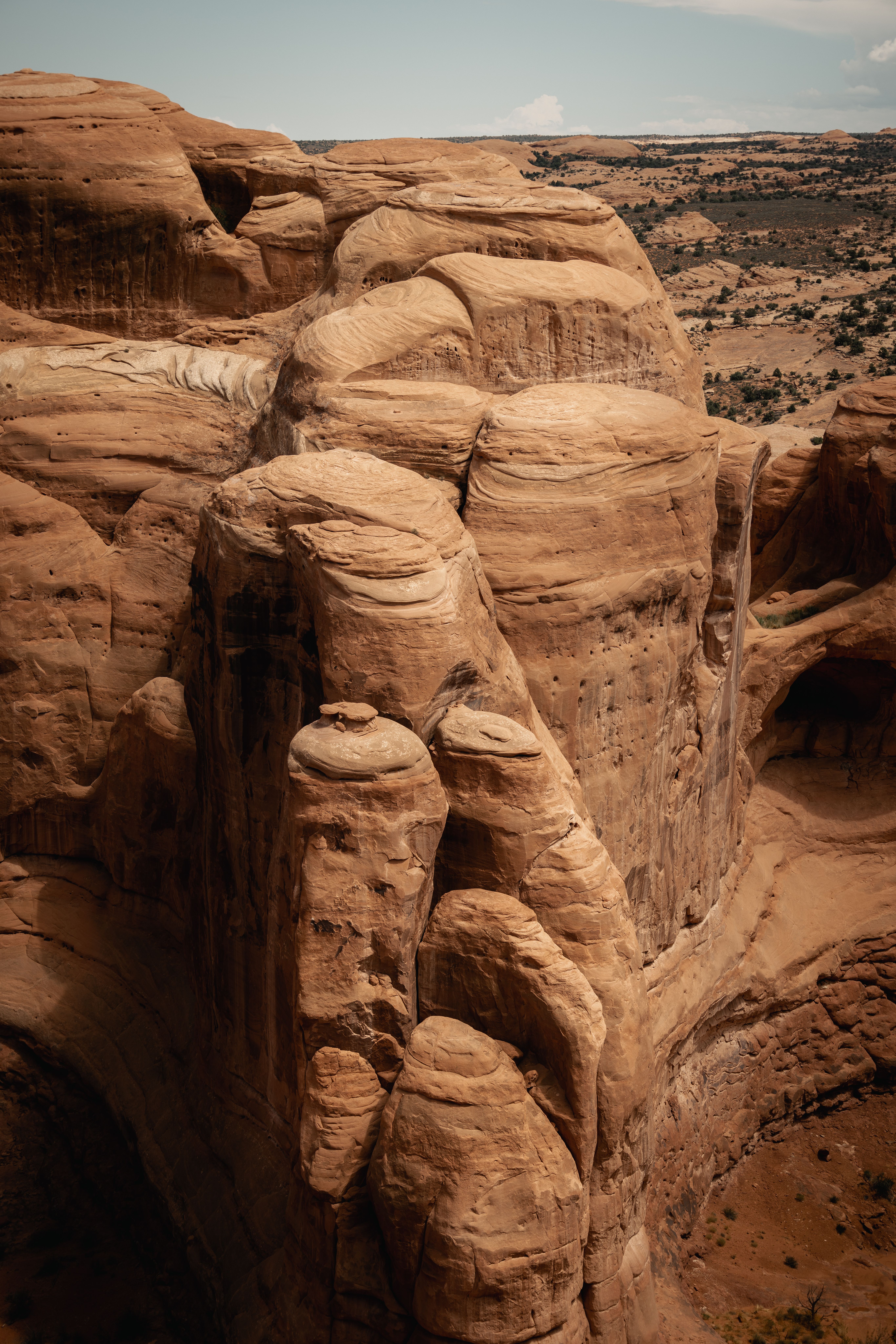 Stunning aerial view of towering sandstone formations in Utah, showcasing natural beauty and geological wonders.