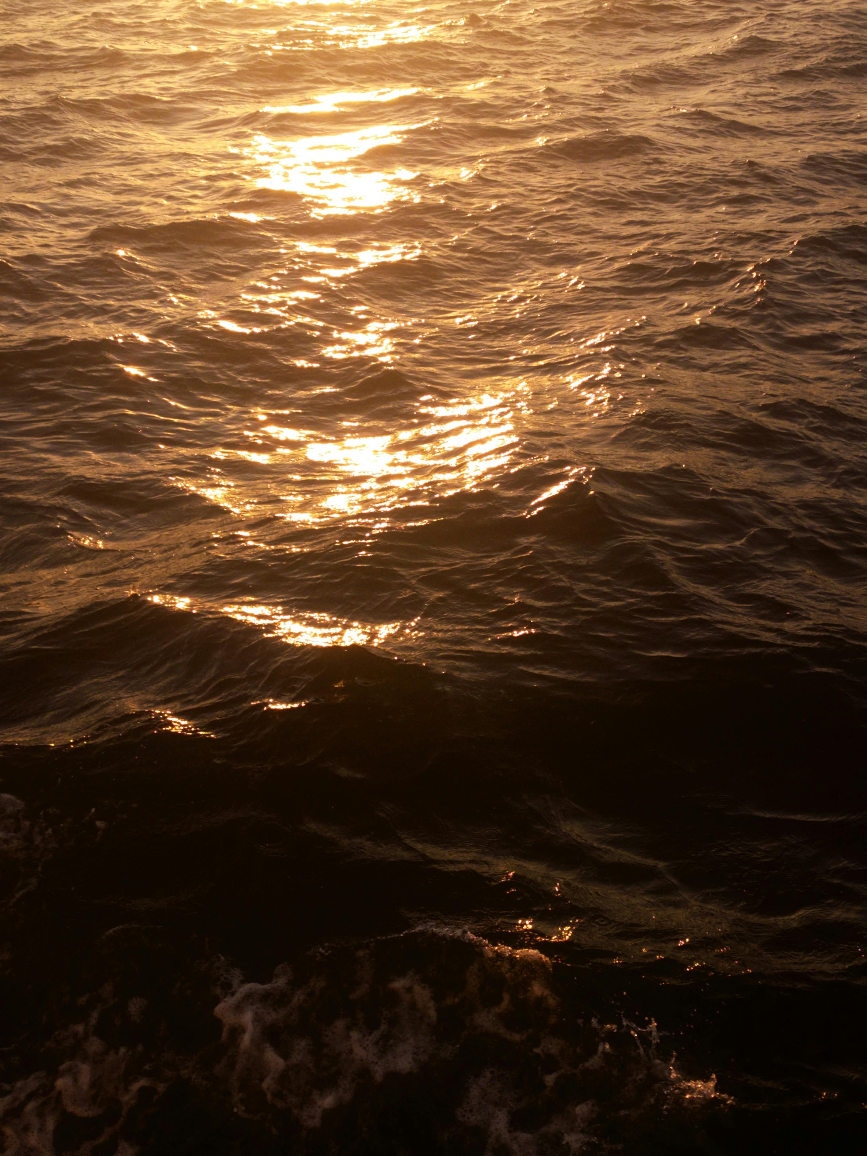 Beautiful sunlight reflecting on the rippling Marmara Sea during sunset in Istanbul.